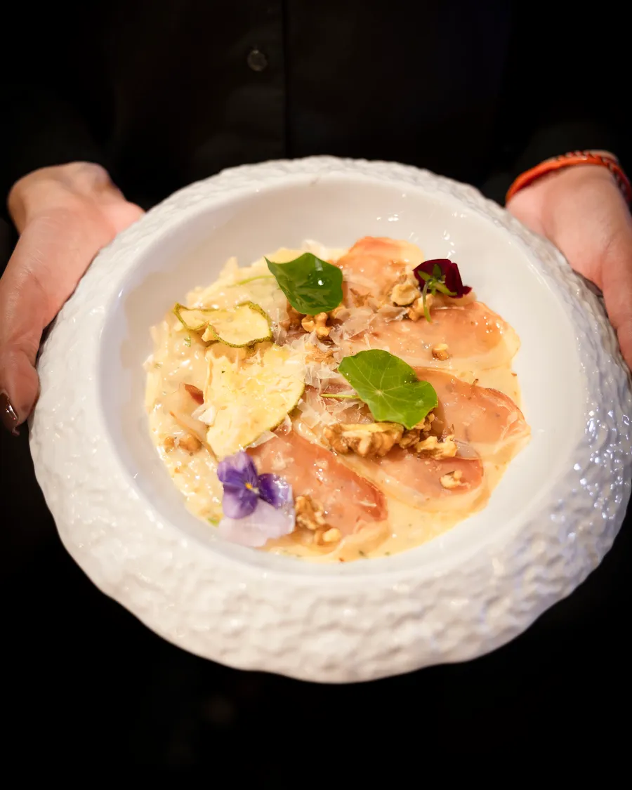 Handmade filled pasta served in a white ceramic bowl